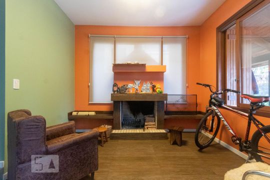 Sala de Estar de casa de condomínio à venda com 4 quartos, 252m² em Cavalhada, Porto Alegre