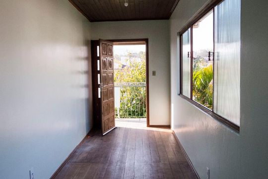 Sala 1 de casa à venda com 4 quartos, 240m² em Campo Novo, Porto Alegre