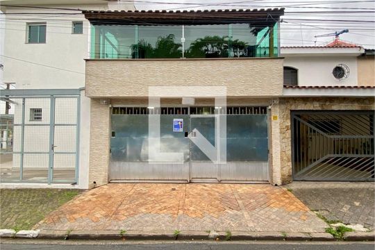 Fachada com plaquinha de casa à venda com 3 quartos, 250m² em Vila Nilo, São Paulo