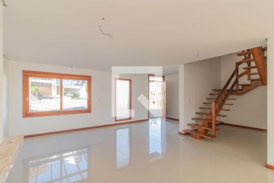 Sala de casa de condomínio à venda com 4 quartos, 240m² em Vila Nova, Porto Alegre