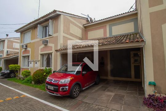 Fachada de casa de condomínio à venda com 4 quartos, 90m² em Humaitá, Porto Alegre