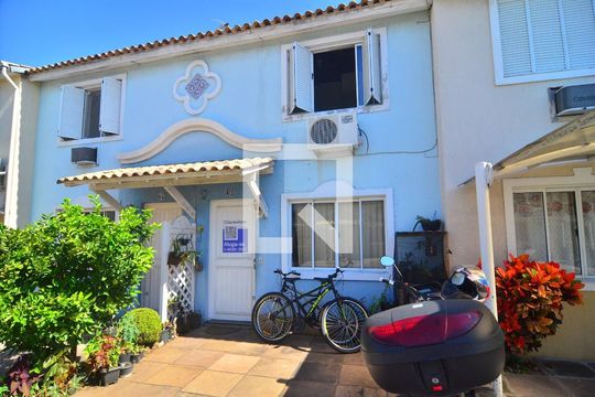 Fachada casa de casa de condomínio à venda com 3 quartos, 89m² em Rio Branco, Canoas