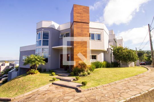 Fachada de casa de condomínio à venda com 3 quartos, 250m² em Hípica, Porto Alegre