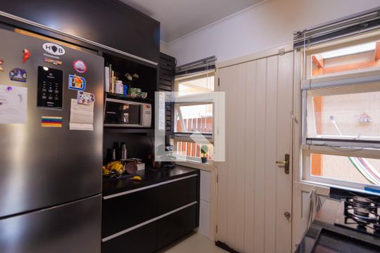 Cozinha de casa de condomínio à venda com 3 quartos, 102m² em Vila Conceição, Porto Alegre