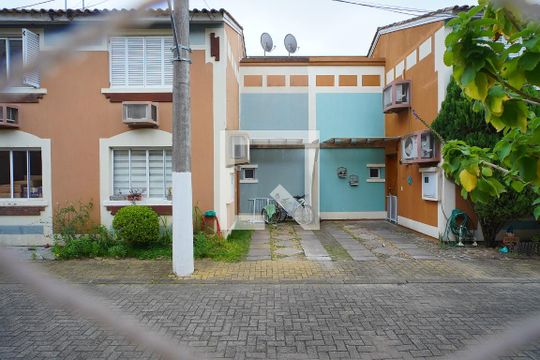 Sala - Vista de casa de condomínio à venda com 3 quartos, 86m² em Jardim Itu, Porto Alegre
