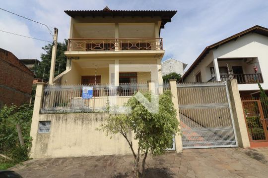 Fachada de casa à venda com 3 quartos, 345m² em Partenon, Porto Alegre