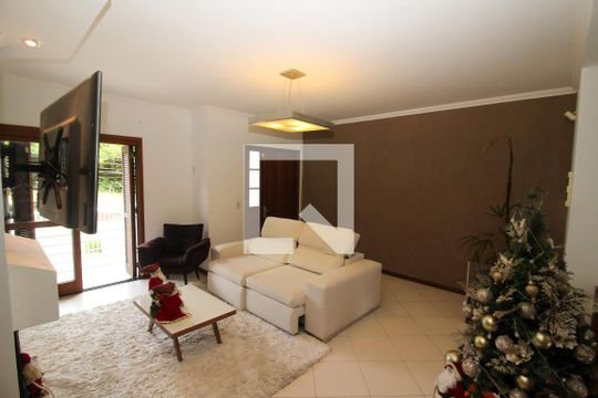 Sala de Estar de casa de condomínio à venda com 3 quartos, 263m² em Campo Novo, Porto Alegre