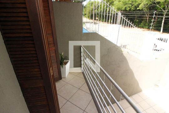 Sacada da Sala de Estar de casa de condomínio à venda com 3 quartos, 263m² em Campo Novo, Porto Alegre