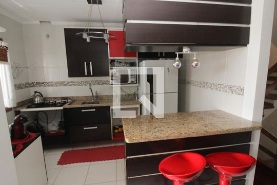Cozinha de casa de condomínio à venda com 3 quartos, 263m² em Campo Novo, Porto Alegre