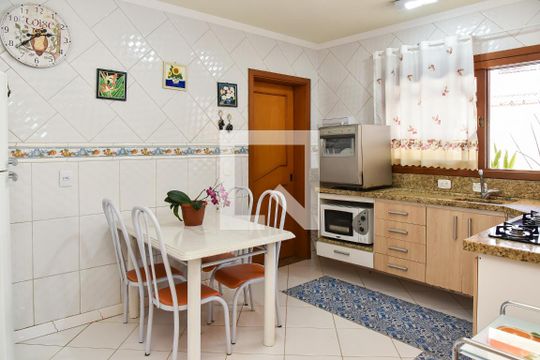Cozinha de casa de condomínio à venda com 4 quartos, 350m² em Sarandi, Porto Alegre