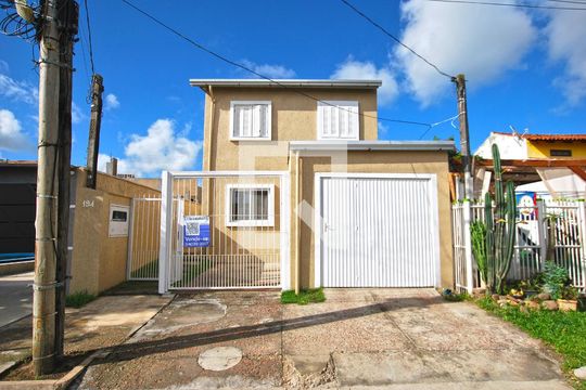 Fachada de casa à venda com 3 quartos, 148m² em Campo Novo, Porto Alegre
