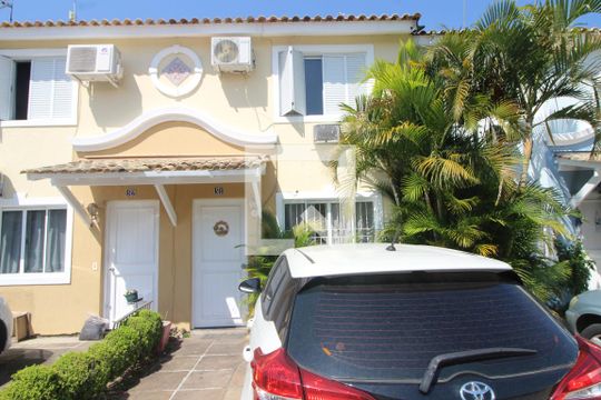 Fachada de casa de condomínio à venda com 3 quartos, 102m² em Rio Branco, Canoas