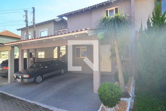 Fachada de casa de condomínio à venda com 3 quartos, 122m² em Harmonia, Canoas