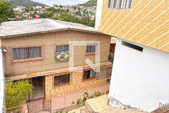 Fachada de casa à venda com 3 quartos, 330m² em Partenon, Porto Alegre