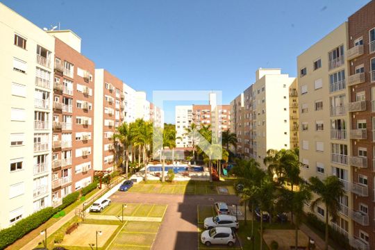 Sala - Vista de apartamento à venda com 2 quartos, 58m² em Vila Nova, Porto Alegre