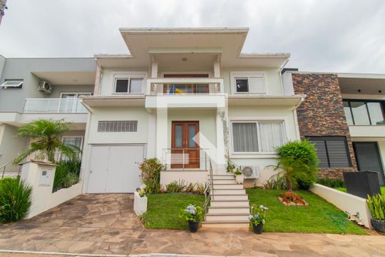 Fachada de casa de condomínio à venda com 5 quartos, 270m² em Hípica, Porto Alegre