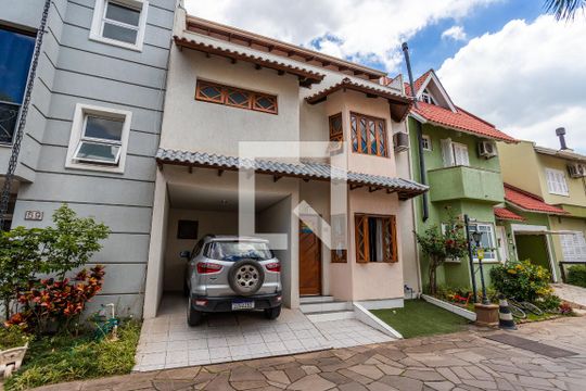 Fachada de casa de condomínio à venda com 3 quartos, 170m² em Sarandi, Porto Alegre