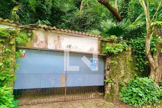 Fachada com cartaz QA de casa à venda com 6 quartos, 1500m² em Gávea, Rio de Janeiro