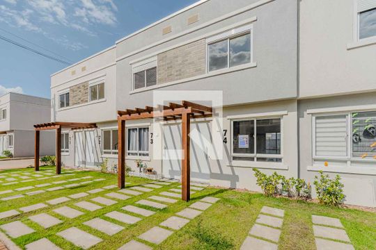 Fachada de casa de condomínio para alugar com 2 quartos, 82m² em Campo Novo, Porto Alegre