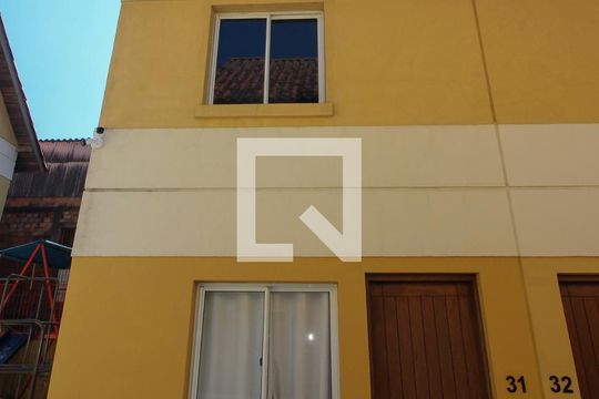 Fachada de casa de condomínio à venda com 2 quartos, 80m² em Santa Tereza, Porto Alegre