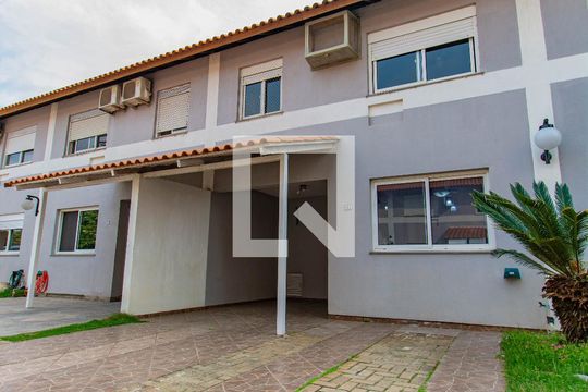 Fachada de casa de condomínio à venda com 3 quartos, 109m² em Fátima, Canoas