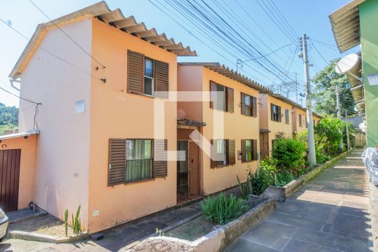 Fachada de casa de condomínio para alugar com 2 quartos, 70m² em Cavalhada, Porto Alegre