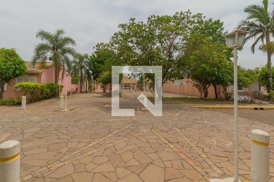Fachada de casa de condomínio à venda com 2 quartos, 87m² em Rio Branco, Canoas