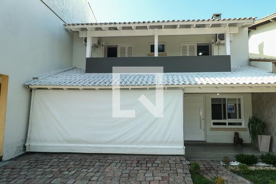 Fachada de casa de condomínio à venda com 3 quartos, 247m² em Sarandi, Porto Alegre