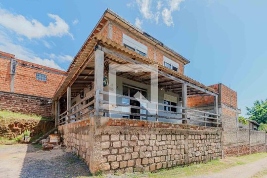Fachada de casa à venda com 4 quartos, 112m² em Vila Nova, Porto Alegre