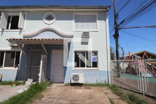 Fachada de casa de condomínio à venda com 2 quartos, 88m² em Rio Branco, Canoas