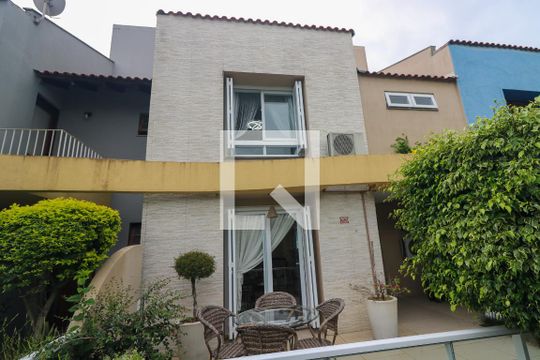 Fachada de casa de condomínio à venda com 4 quartos, 240m² em Ipanema, Porto Alegre