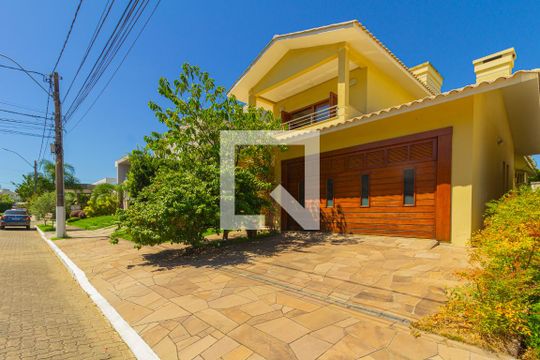 Fachada da casa de casa de condomínio para alugar com 3 quartos, 252m² em Igara, Canoas