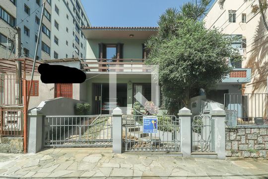 Fachada de casa à venda com 3 quartos, 250m² em Auxiliadora, Porto Alegre