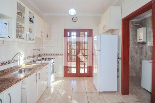 Cozinha e Área de Serviço de casa de condomínio à venda com 2 quartos, 147m² em Sarandi, Porto Alegre