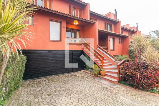 Fachada de casa de condomínio à venda com 3 quartos, 382m² em Cristal, Porto Alegre