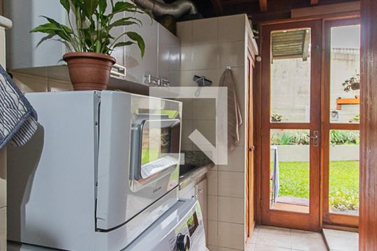 Cozinha e Área de Serviço de casa de condomínio à venda com 3 quartos, 126m² em Vila Nova, Porto Alegre