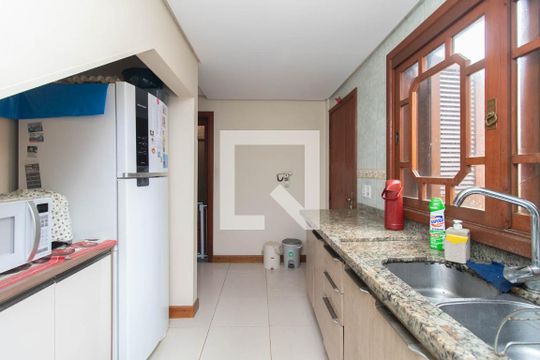 Cozinha e Área de Serviço de casa à venda com 3 quartos, 154m² em Vila Nova, Porto Alegre