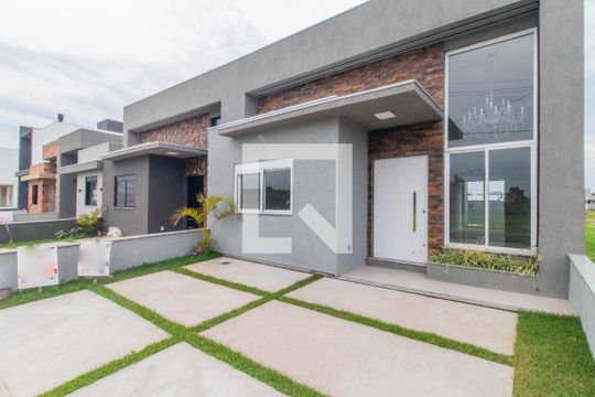 Fachada de casa de condomínio à venda com 3 quartos, 89m² em Cavalhada, Porto Alegre