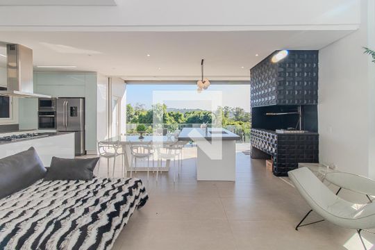 Sala de casa de condomínio à venda com 3 quartos, 309m² em Vila Nova, Porto Alegre