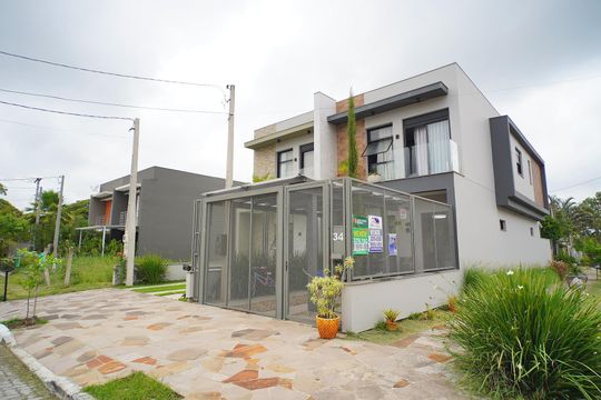 Fachada de casa de condomínio à venda com 3 quartos, 129m² em Hípica, Porto Alegre