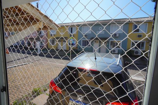 Sala - Vista de casa de condomínio à venda com 3 quartos, 72m² em Sarandi, Porto Alegre