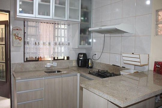 Cozinha  de casa à venda com 3 quartos, 180m² em Costa E Silva, Porto Alegre