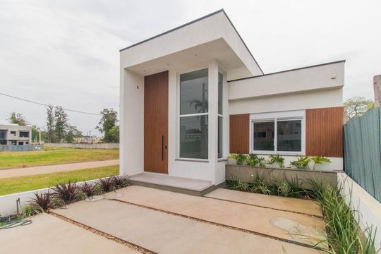 Fachada de casa de condomínio à venda com 3 quartos, 96m² em Cavalhada, Porto Alegre