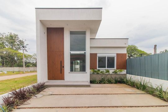 Fachada de casa de condomínio à venda com 3 quartos, 96m² em Cavalhada, Porto Alegre