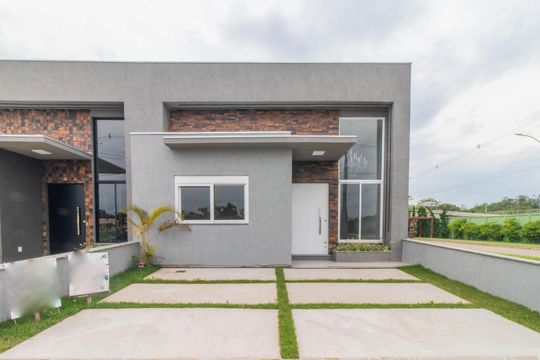 Fachada de casa de condomínio à venda com 3 quartos, 89m² em Cavalhada, Porto Alegre