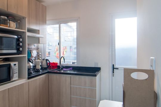 Cozinha de casa de condomínio à venda com 3 quartos, 87m² em Hípica, Porto Alegre