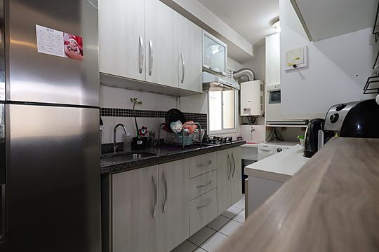 Cozinha Área de Serviço - Armários de apartamento à venda com 3 quartos, 67m² em Humaitá, Porto Alegre