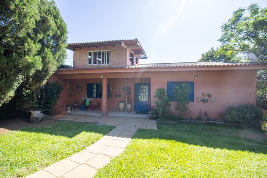 Fachada de casa à venda com 3 quartos, 100m² em Vila Nova, Porto Alegre