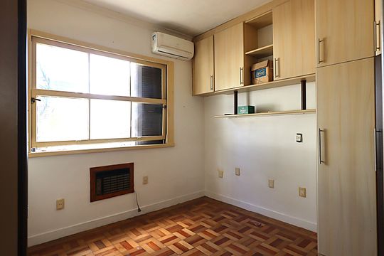 Quarto 1 de apartamento para alugar com 2 quartos, 78m² em Auxiliadora, Porto Alegre