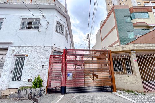 Fachada com Plaquinha de casa para alugar com 2 quartos, 100m² em Vila Gomes Cardim, São Paulo